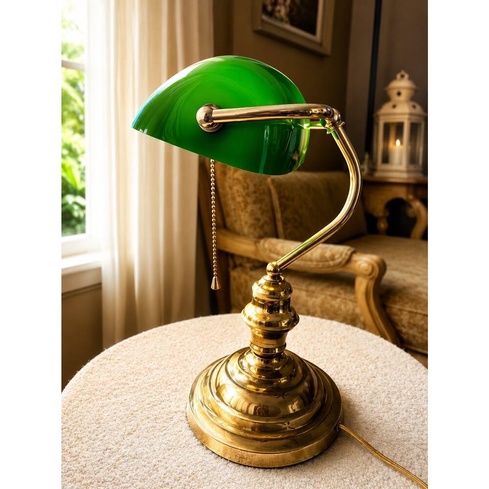 Victorian-style banker's lamp features a green glass shade and a polished brass
